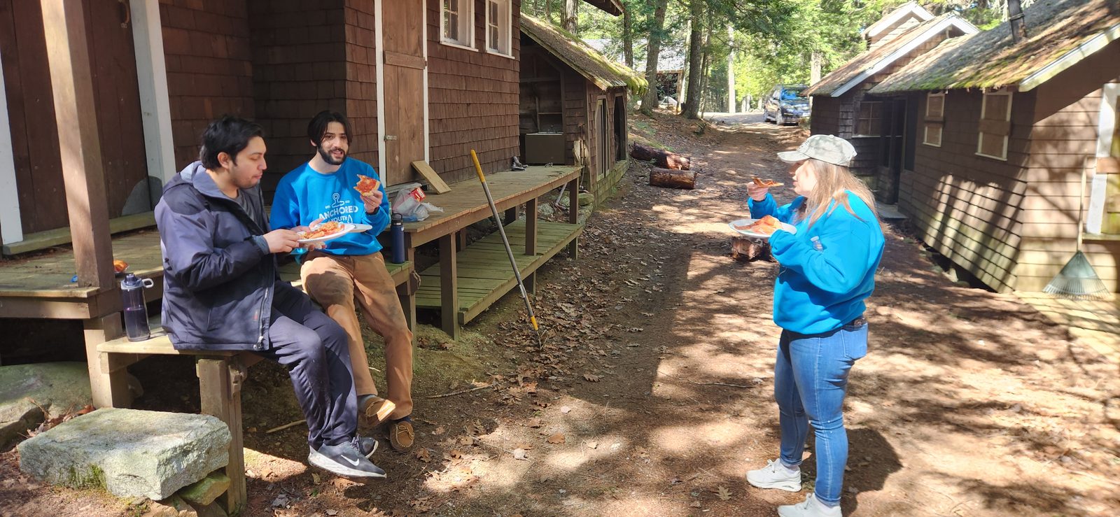 Guests gathered on the path between the cabins at Craig Pond