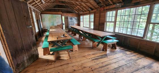 Picnic tables inside the lodge dining hall