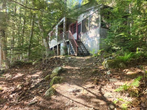A cabin above the path up from the water