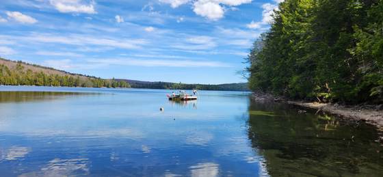 Moving the floating dock into place on a blue-sky day