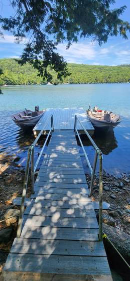 Boats tied up at the end of the dock