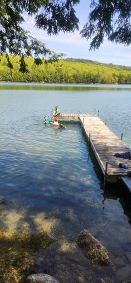 The dock reaching out into clear shallow water
